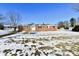 Brick ranch house with snow-covered yard at 6240 W Mills Rd, Indianapolis, IN 46221