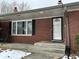 Brick ranch home with attached garage and front porch at 6351 St Jean Dr, Indianapolis, IN 46217