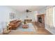 Living room with fireplace, hardwood floors, and ceiling fan at 6573 Crossbridge Dr, Noblesville, IN 46062