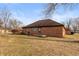 Brick home's backyard with patio and partial grass at 710 Eagle Pkwy # 15, Brownsburg, IN 46112