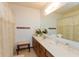 Bathroom with a wooden vanity and lace curtains at 710 Eagle Pkwy # 15, Brownsburg, IN 46112