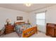 Bright bedroom with a comfortable queen-size bed at 710 Eagle Pkwy # 15, Brownsburg, IN 46112