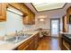 Kitchen with stainless steel sink and wood cabinets at 710 Eagle Pkwy # 15, Brownsburg, IN 46112
