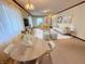 Bright living room featuring a round table, white sofa, light-colored walls, and neutral furniture at 710 Eagle Pkwy # 15, Brownsburg, IN 46112