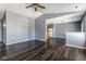 Open living room and kitchen with dark hardwood floors and gray walls at 7328 Woodside Dr, Avon, IN 46123