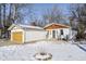 House exterior showcasing a wooden accent and snowy landscape at 769 Iron Bridge Rd, Cicero, IN 46034