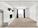 Large basement room with a white brick fireplace at 7803 Opelika Ct, Indianapolis, IN 46217