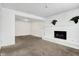 Unfinished basement featuring a white brick fireplace at 7803 Opelika Ct, Indianapolis, IN 46217