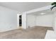 Unfinished basement room with carpet and access to utilities at 7803 Opelika Ct, Indianapolis, IN 46217