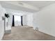 Spacious basement with a white brick fireplace and window at 7803 Opelika Ct, Indianapolis, IN 46217