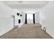 Finished basement with a white brick fireplace and window at 7803 Opelika Ct, Indianapolis, IN 46217