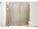 Simple bathroom with shower/tub and bamboo shower curtain at 7803 Opelika Ct, Indianapolis, IN 46217