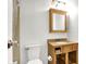 Clean bathroom with a vanity, toilet and shower/tub combo at 7803 Opelika Ct, Indianapolis, IN 46217