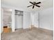 Spacious bedroom with ceiling fan and double door closet at 7803 Opelika Ct, Indianapolis, IN 46217