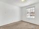 Well-lit bedroom with window and neutral colored carpet at 7803 Opelika Ct, Indianapolis, IN 46217