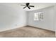 Spacious bedroom with ceiling fan and window at 7803 Opelika Ct, Indianapolis, IN 46217
