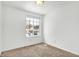 Charming bedroom with a window offering a view and neutral walls at 7803 Opelika Ct, Indianapolis, IN 46217