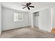 Large bedroom with ceiling fan, closet, and access to bathroom at 7803 Opelika Ct, Indianapolis, IN 46217