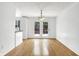 Dining room featuring hardwood floors and access to a deck at 7803 Opelika Ct, Indianapolis, IN 46217
