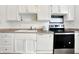 Kitchen with white cabinets, stainless steel appliances and double sink at 7803 Opelika Ct, Indianapolis, IN 46217