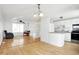 Eat-in kitchen with stainless steel appliances and light cabinets at 7803 Opelika Ct, Indianapolis, IN 46217