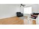 Living room with hardwood floors and a recliner chair at 7803 Opelika Ct, Indianapolis, IN 46217