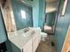 Bathroom featuring a vanity with sink, a large mirror, tile flooring, and a toilet for convenience at 7903 Roseway Ct, Indianapolis, IN 46226