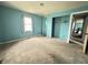 Spacious bedroom with a window for natural light and an open closet, ready for personalization at 7903 Roseway Ct, Indianapolis, IN 46226