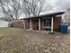 Charming brick home with covered porch and gravel driveway at 7903 Roseway Ct, Indianapolis, IN 46226