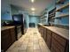 Well-lit kitchen with tile floor and wooden countertops at 7903 Roseway Ct, Indianapolis, IN 46226
