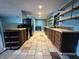 Renovated kitchen featuring modern appliances and stylish open shelving at 7903 Roseway Ct, Indianapolis, IN 46226