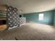 Cozy living room with adjoining kitchen and neutral carpet at 7903 Roseway Ct, Indianapolis, IN 46226