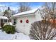 White storage shed with two wreaths on the door at 820 Dayton Dr, Carmel, IN 46033