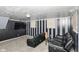 Finished basement with black and gray striped walls and two reclining chairs at 8224 Barry Rd, Indianapolis, IN 46219