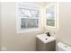Small bathroom with updated vanity and a lighted mirror at 8224 Barry Rd, Indianapolis, IN 46219