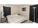 Bright bedroom with a double bed, nightstands, and ample closet space at 8224 Barry Rd, Indianapolis, IN 46219