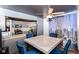 Dining area with a marble table and blue velvet chairs at 8224 Barry Rd, Indianapolis, IN 46219