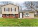 Brick and beige two-story house with a well-maintained lawn at 8224 Barry Rd, Indianapolis, IN 46219