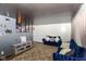 Open living area with a gray accent wall and dark wood floors at 8224 Barry Rd, Indianapolis, IN 46219
