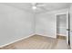 Bright bedroom with neutral walls, carpet, and ceiling fan at 8408 Valley Estates Dr, Indianapolis, IN 46227