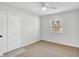 Bright bedroom featuring a window, closet, and ceiling fan at 8408 Valley Estates Dr, Indianapolis, IN 46227