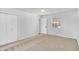 Bright bedroom with window, carpet, and double-door closet at 8408 Valley Estates Dr, Indianapolis, IN 46227