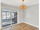 Dining room features hardwood floors and sliding glass doors to patio at 8408 Valley Estates Dr, Indianapolis, IN 46227