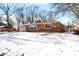 Brick ranch house with attached garage and snow-covered landscaping at 8408 Valley Estates Dr, Indianapolis, IN 46227