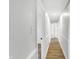 Light and bright hallway with hardwood floors and neutral walls at 8408 Valley Estates Dr, Indianapolis, IN 46227