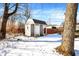 Gray storage shed with white door in snowy backyard at 8408 Valley Estates Dr, Indianapolis, IN 46227