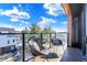 Modern balcony with city views and two chairs, perfect for relaxing at 855 N East St # 302, Indianapolis, IN 46202