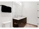 Modern bathroom with double vanity and a large mirror at 855 N East St # 302, Indianapolis, IN 46202