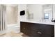Clean bathroom, double vanity, and updated bathtub at 855 N East St # 302, Indianapolis, IN 46202