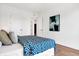 Charming bedroom with a queen-size bed and modern art at 855 N East St # 302, Indianapolis, IN 46202